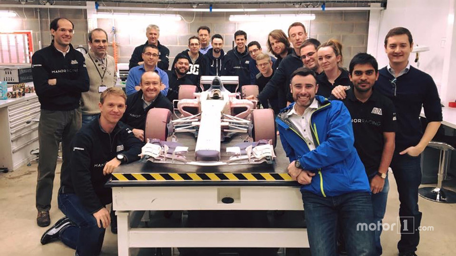 Manor wind tunnel model car with the team
