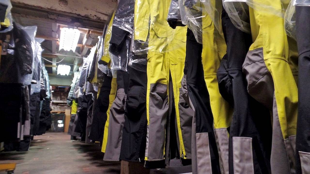 <em>The basement contains suits waiting to be shipped out to customers. Thanks to a laser cutting machine, Aerostich is able to produce suits pretty quickly upon their being ordered, which means low overhead.</em>