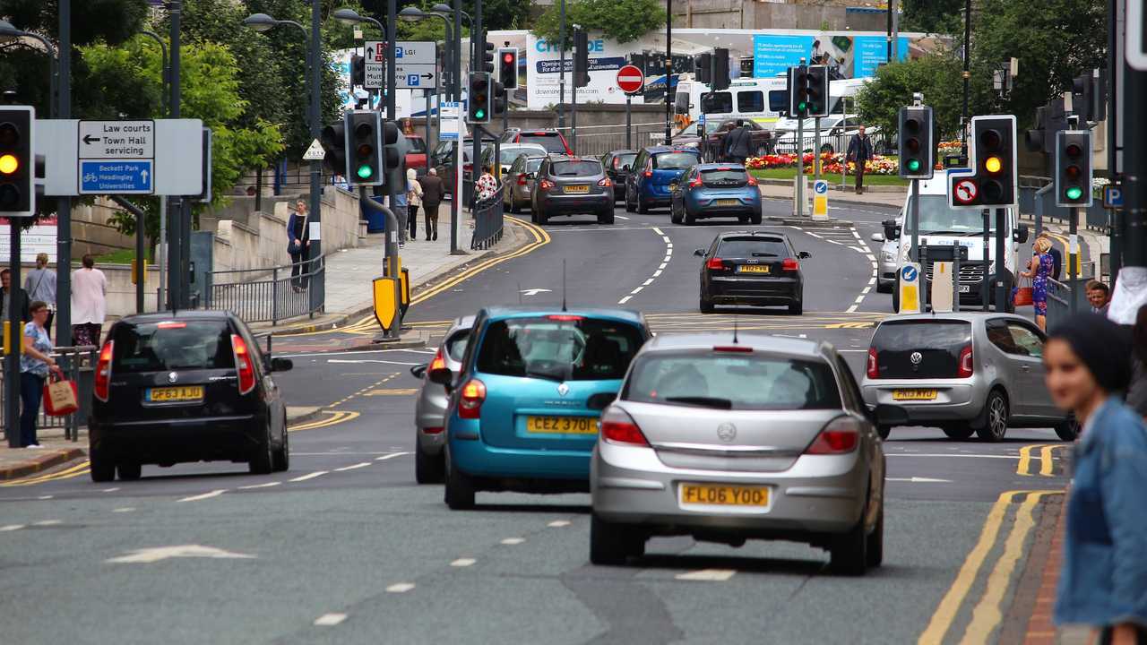 Cars driving in downtown Leeds UK