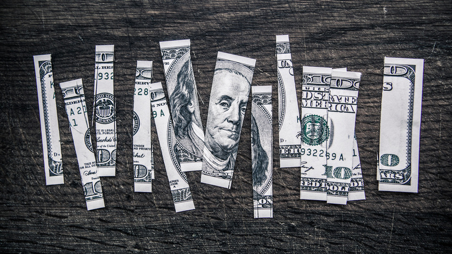 100 dollar bill cut up