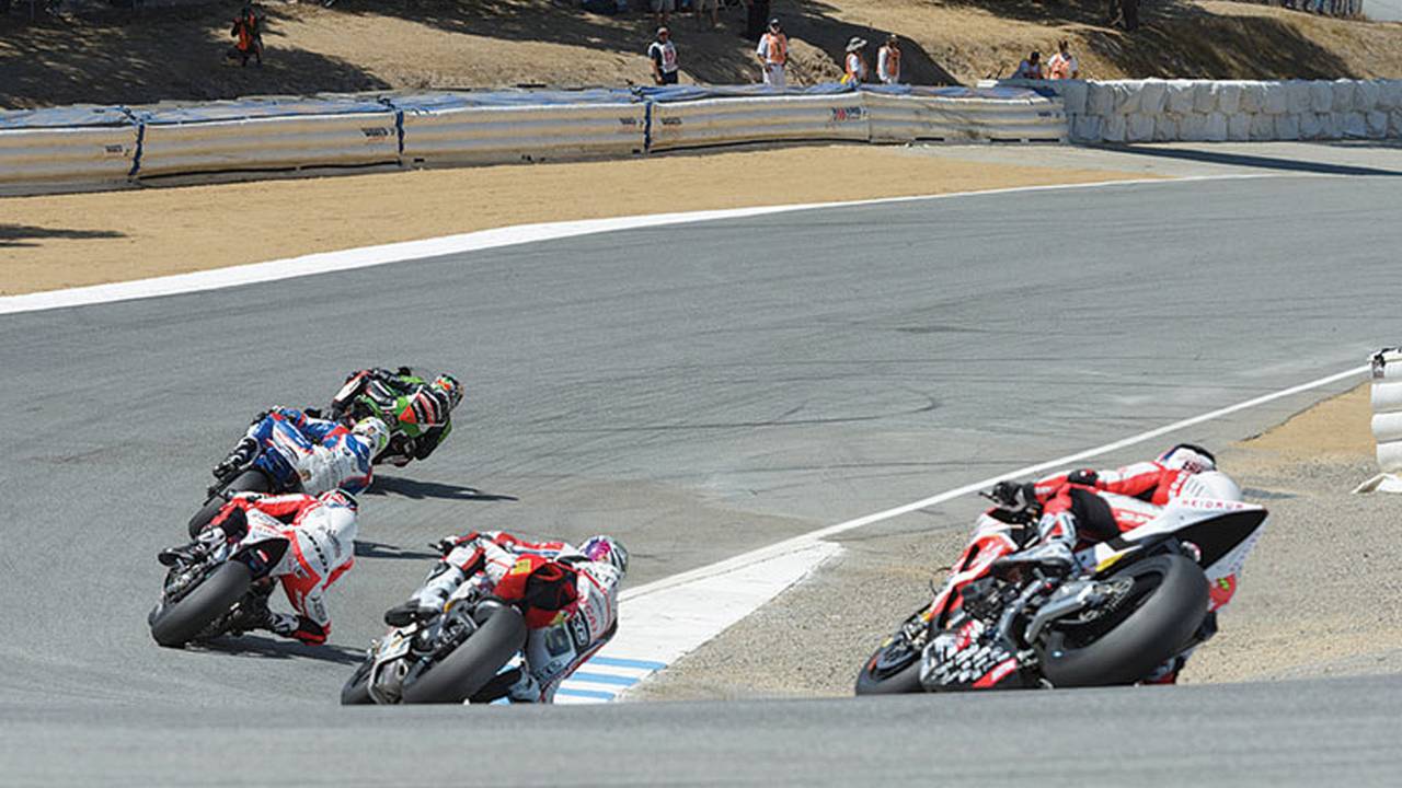 Mid-field grouping heads down The Corkscrew led by Jeremy Guarnoni (#11, Kawasaki)