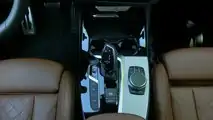 BMW X3 30e (2020): Mittelkonsole mit Automatik-Hebel, Modus-Knöpfen (links) und Dreh-Drücksteller für die Bedienung des Displays
