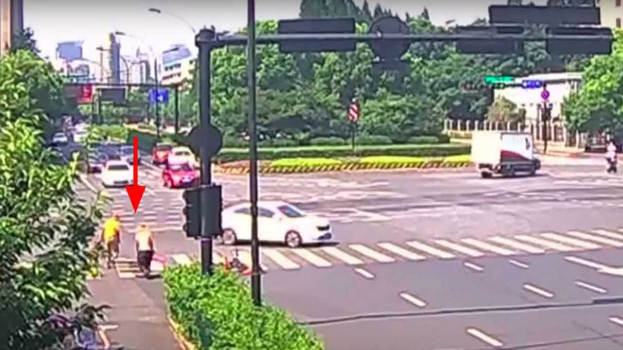 Watch a Scooter Rider Get Hit By a Car then Fall Down a Hole