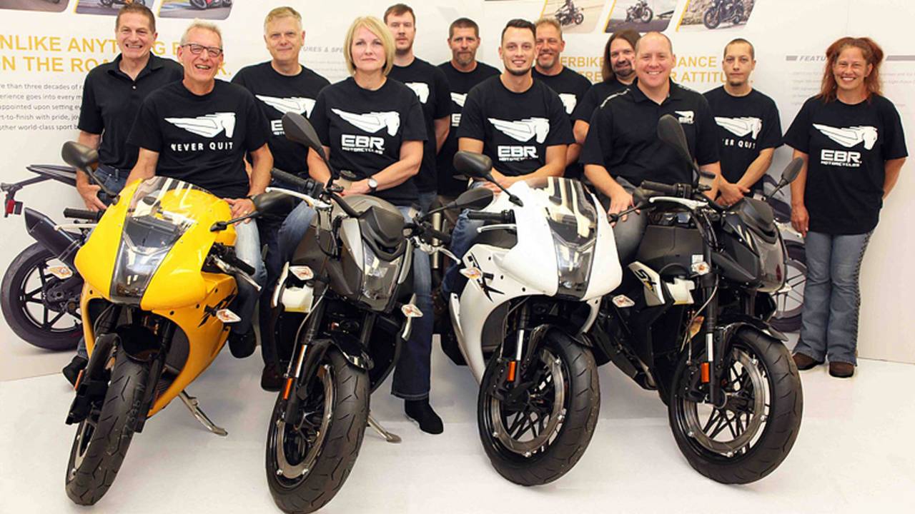 <strong>The crew at EBR Motorcycles announced they are back in business and from the looks of things they are all smiles! Except for that guy in the back row on the right. Why is he not happy?<section contenteditable=