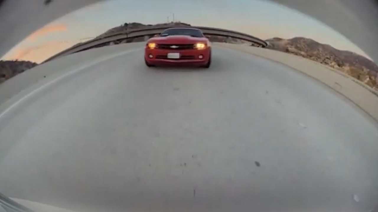 See This Camaro Driver Throw A Bunch Of Coins In a Tesla Model 3