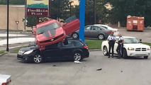 Chevrolet Camaro and Subaru Outback crash