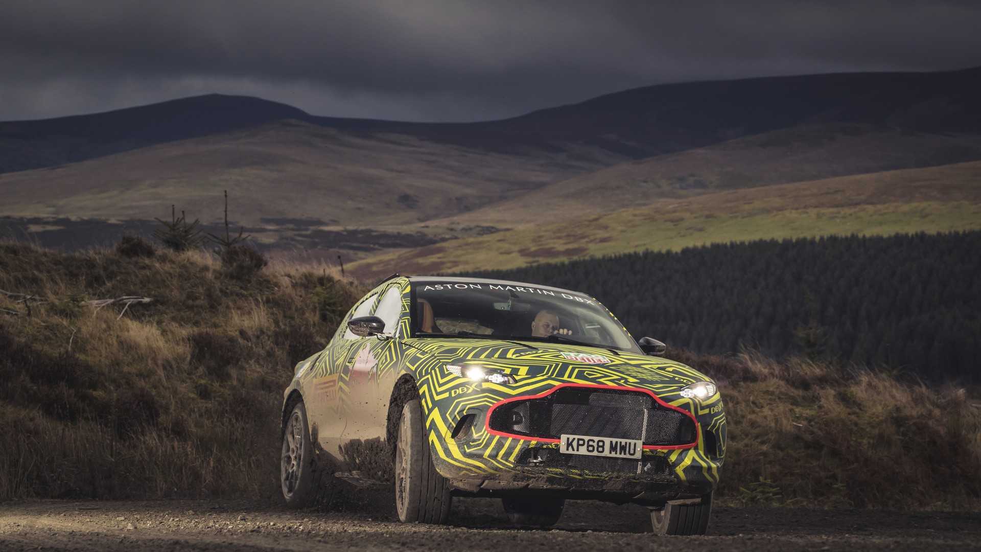https://cdn.motor1.com/images/mgl/eVk7E/s1/aston-martin-dbx-teaser.jpg aston-martin-dbx-teaser