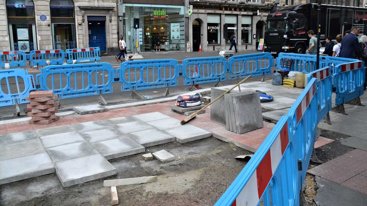 London roadworks with a blue safety barrier