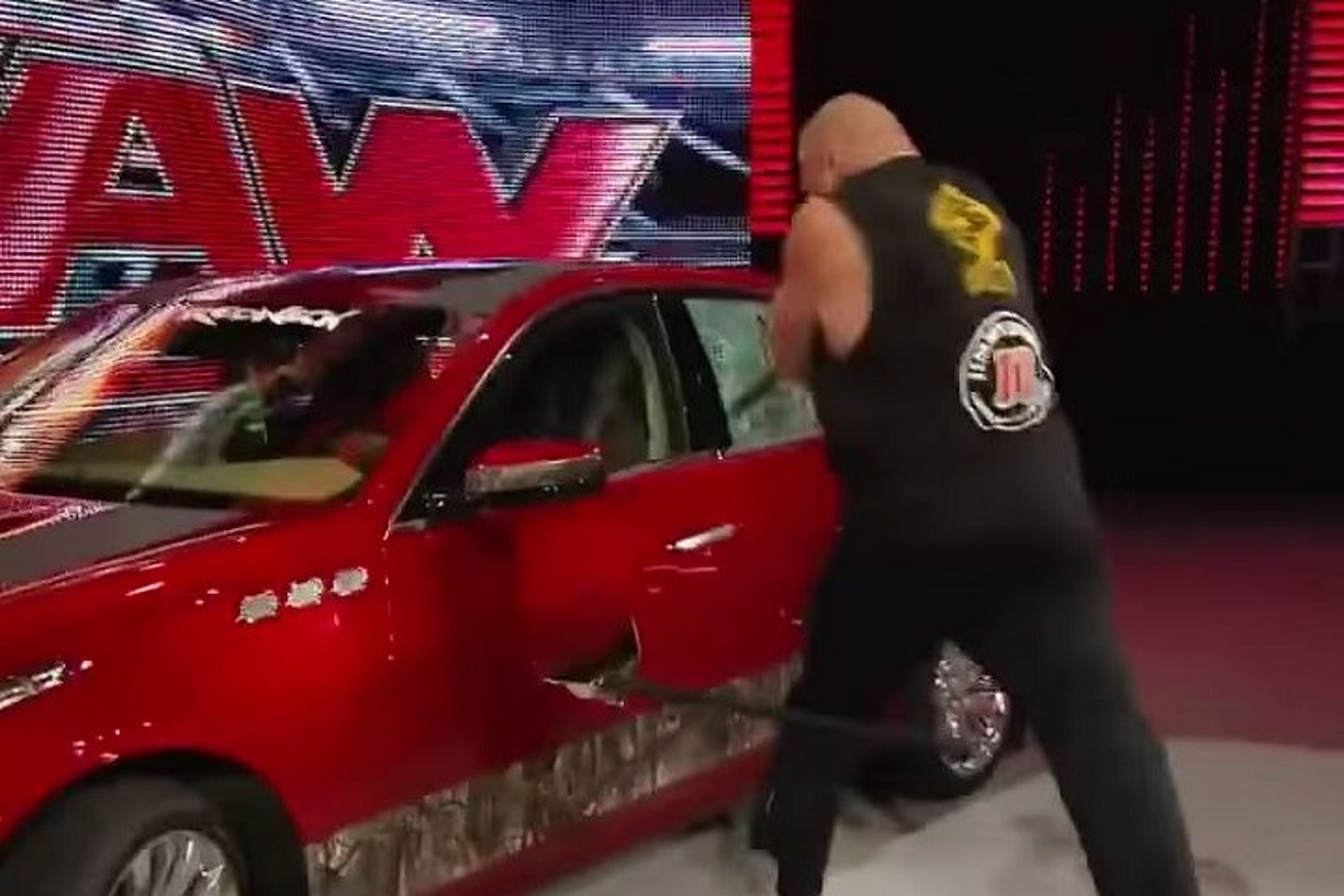 WWEs Brock Lesnar Demolishes a Cadillac CTS With an Axe