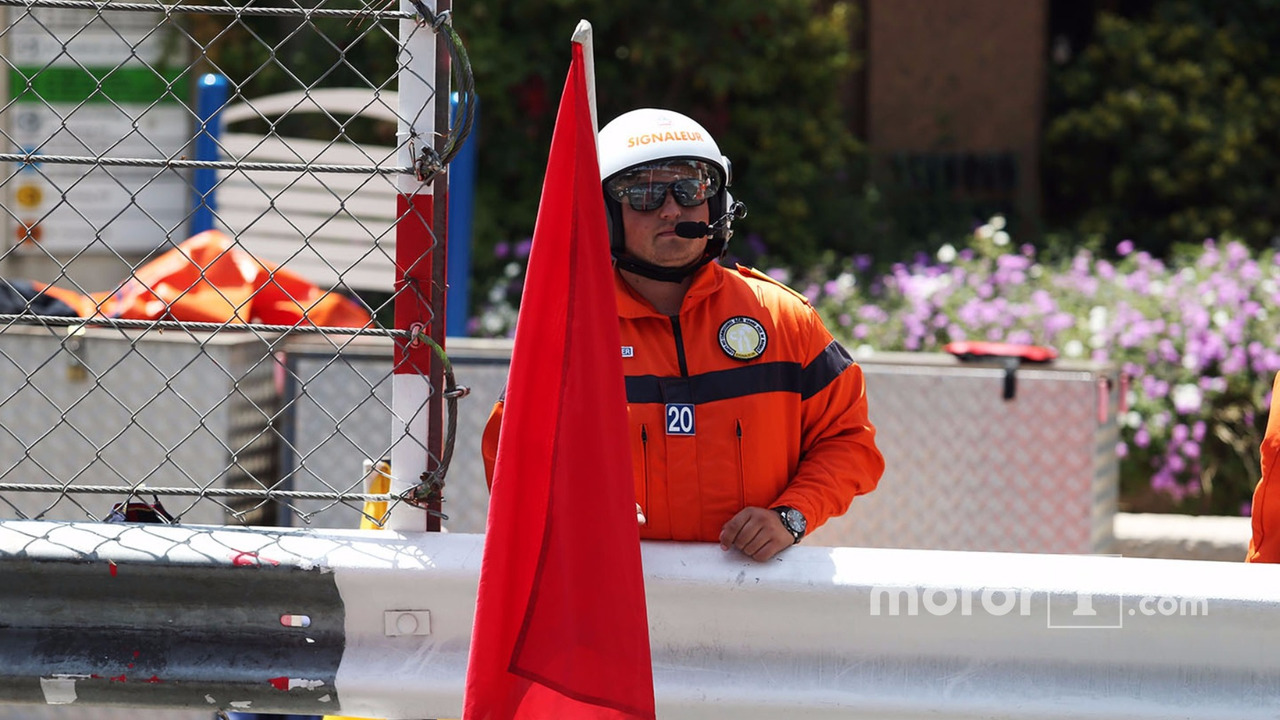 Marshal with a red flag