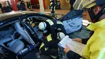 Porsche Panamera being cut apart from the fire brigade