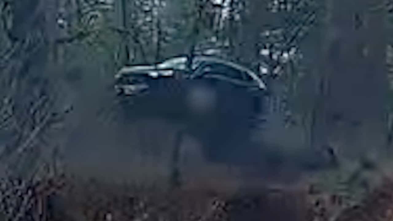 driver launches honda crv off embankment down hill