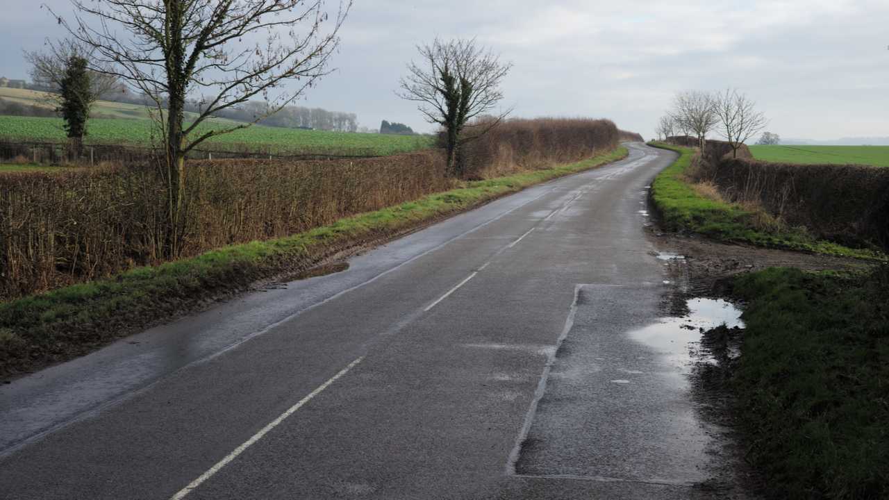 Rural wet country road in Leicestershire UK