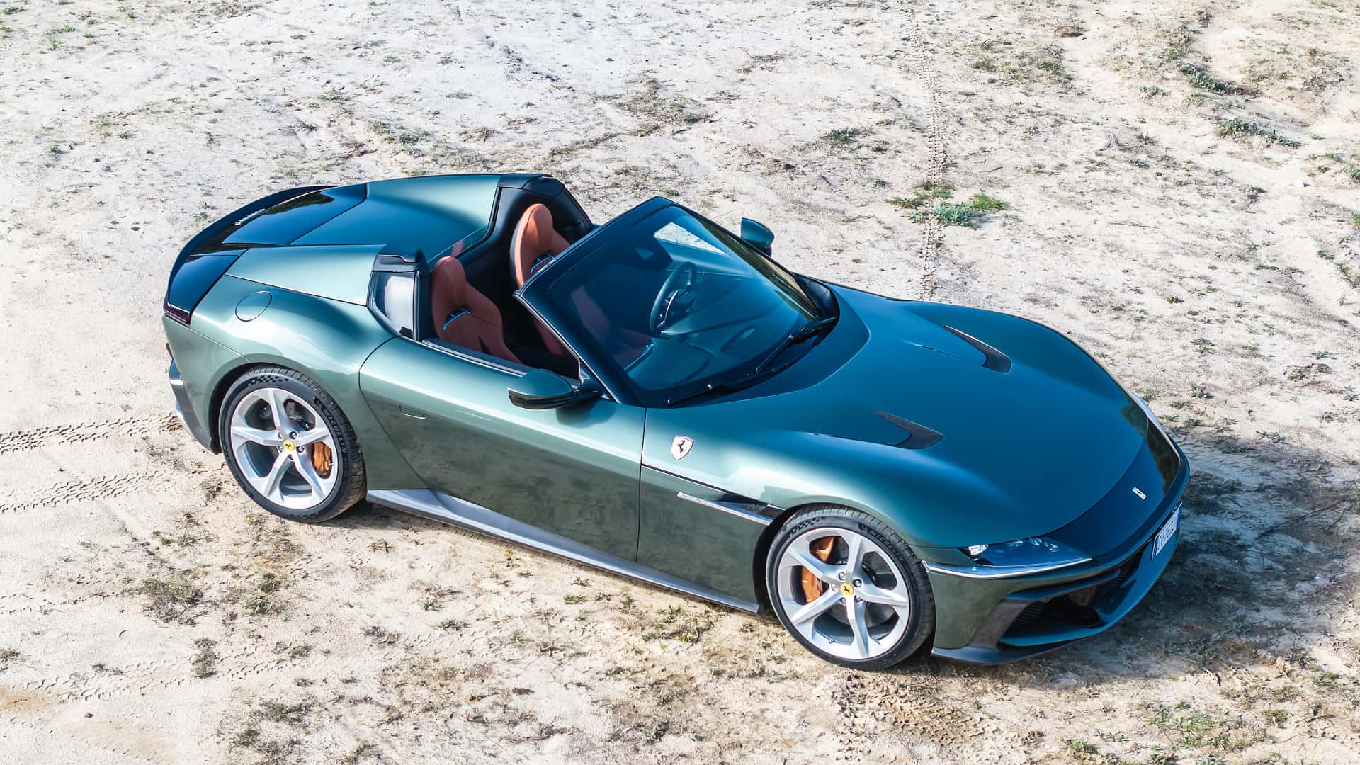 https://cdn.motor1.com/images/mgl/ko4YYR/s1/2025-ferrari-12cilindri-spider-first-drive-review.jpg