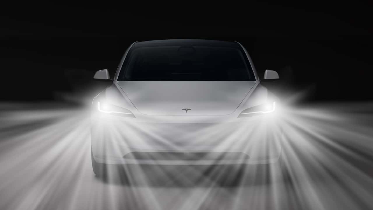Tesla Model 3 Bright Headlights Hero