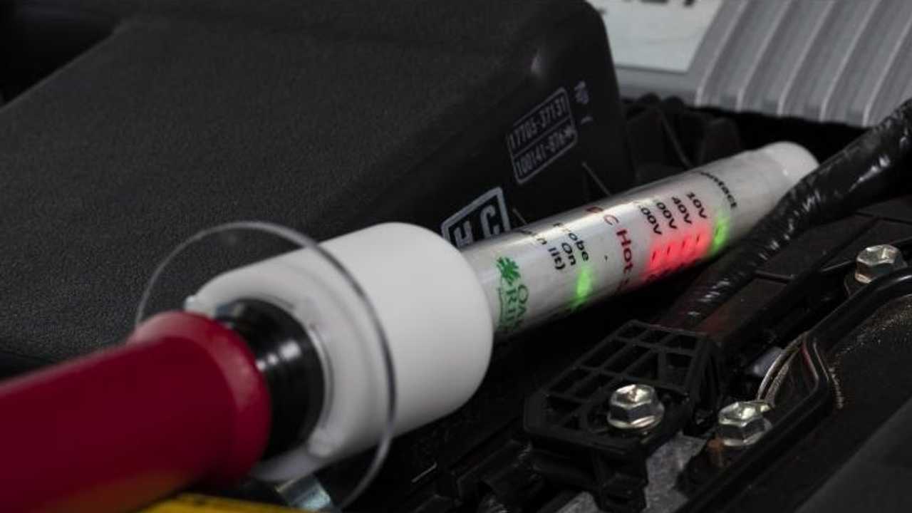 The DC hotstick voltage probe can accurately detect the presence of DC voltages in a hybrid electric vehicle. Credit: Carlos Jones/Oak Ridge National Laboratory, U.S. Dept. of Energy.