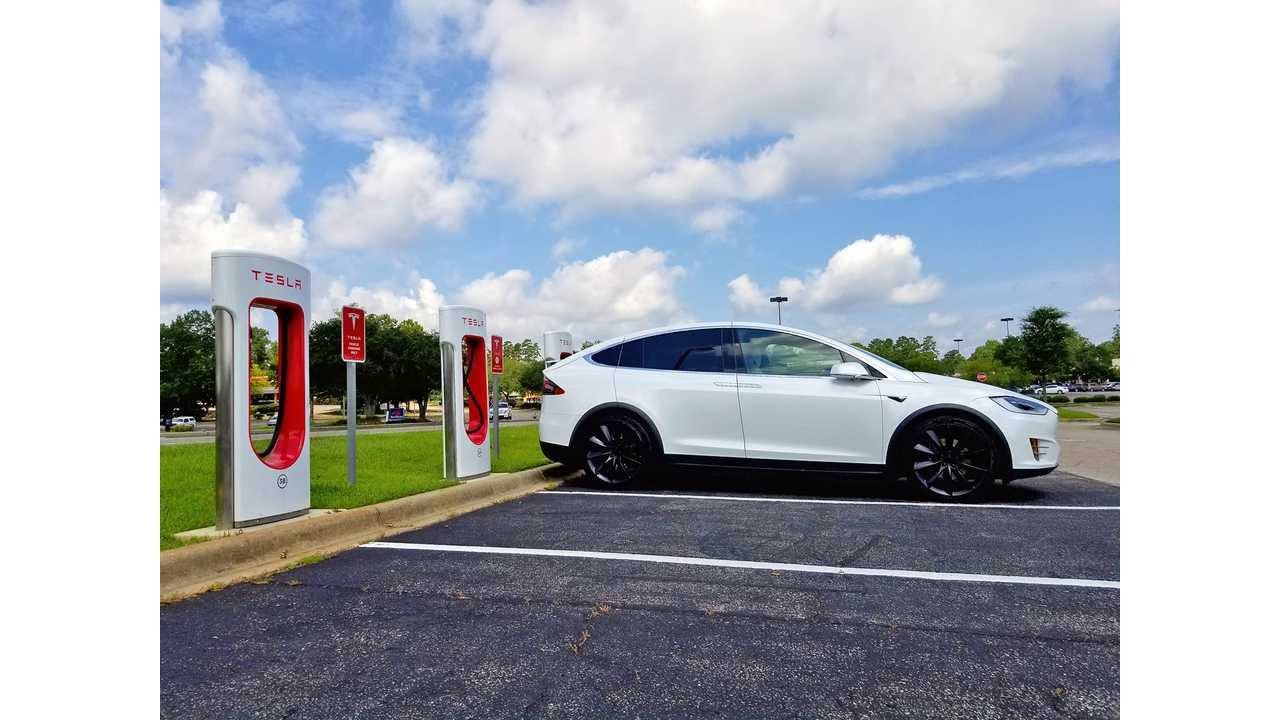 <em>Model X charging at a Tesla Supercharger</em>