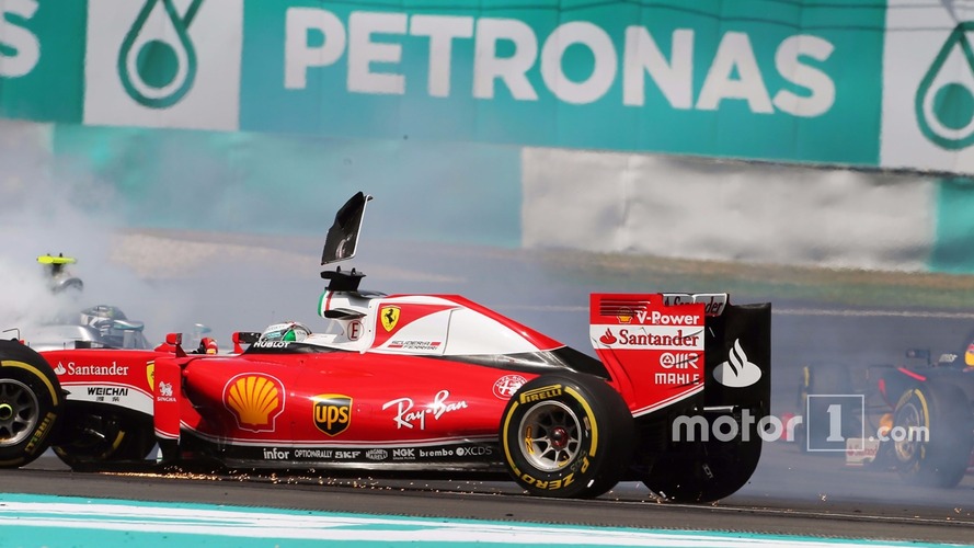 Sebastian Vettel, Ferrari SF16-H and Nico Rosberg, Mercedes AMG F1 W07 Hybrid collide at the start of the race