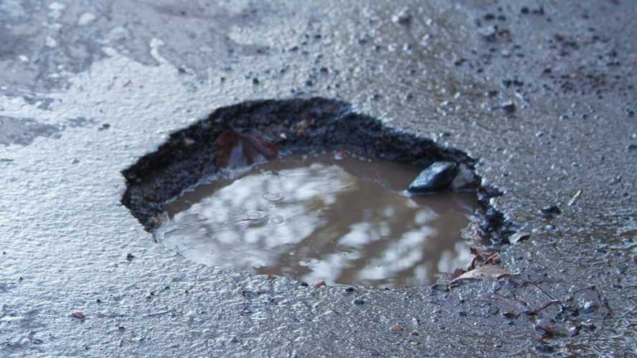 Large deep pothole in UK road