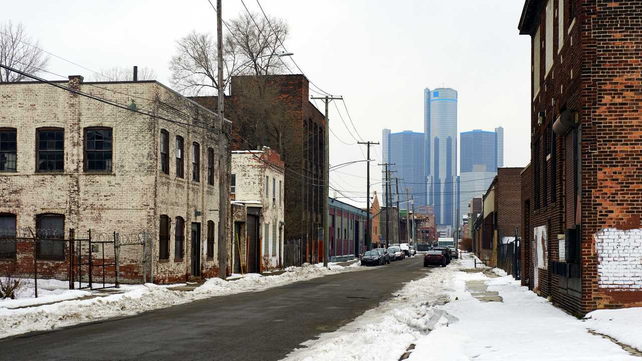General Motors Detroit headquarters building behind condemned abandoned buildings