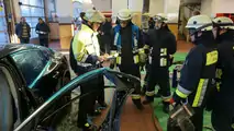 Porsche Panamera being cut apart from the fire brigade