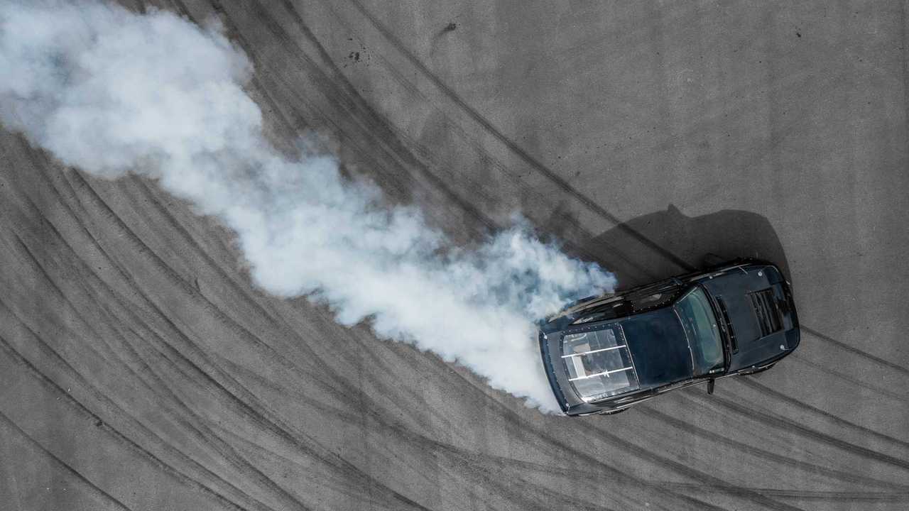 Aerial view of drifting car on asphalt track