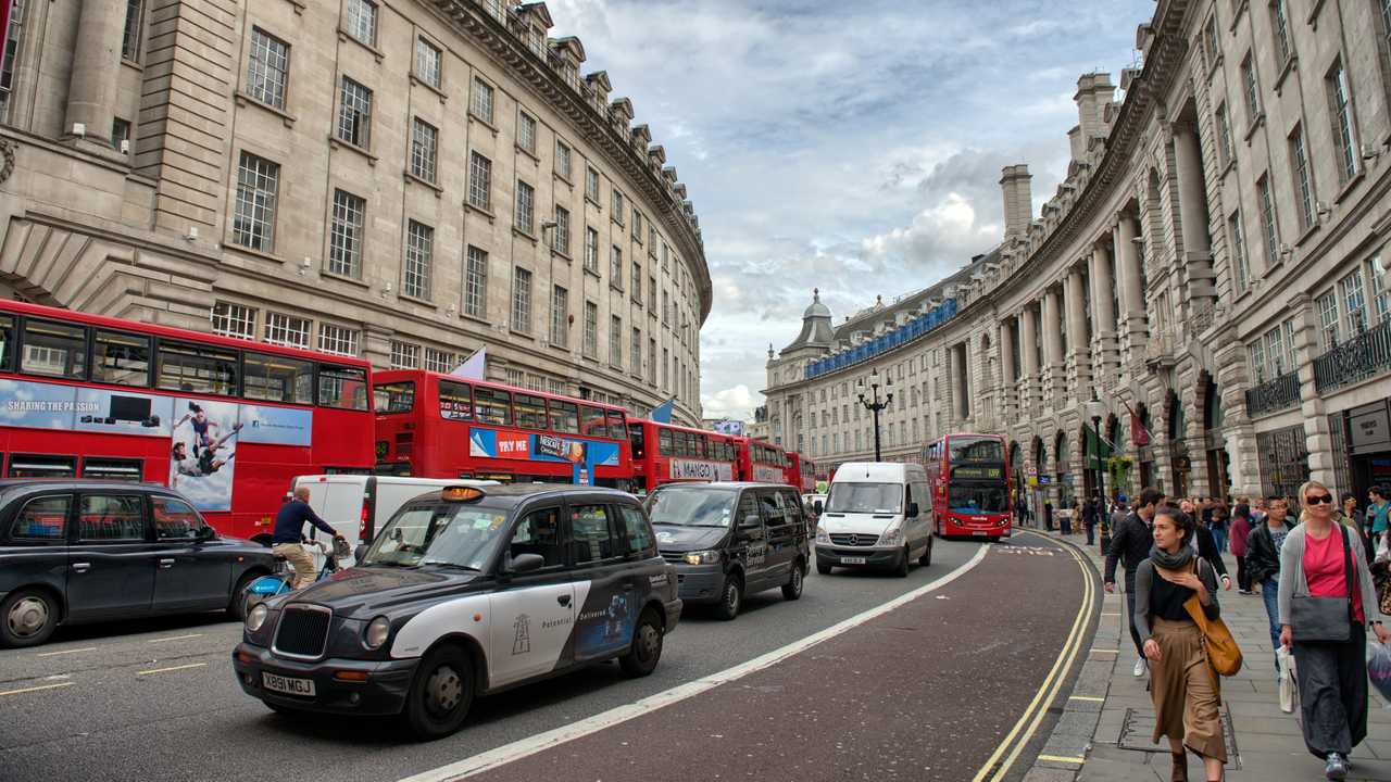 Pedestrians and traffic on Regent Street in London