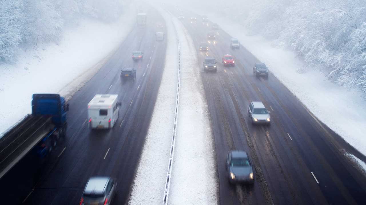 Traffic on motorway during snow storm