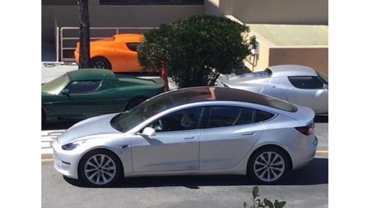 <em>Spy shot of a silver Model 3 release candidate spotted yesterday in front of some Tesla Roadsters</em>