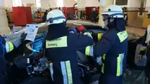 Porsche Panamera being cut apart from the fire brigade