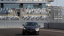 Sebastian Vettel laps Sochi GP circuit in an Infiniti Q50