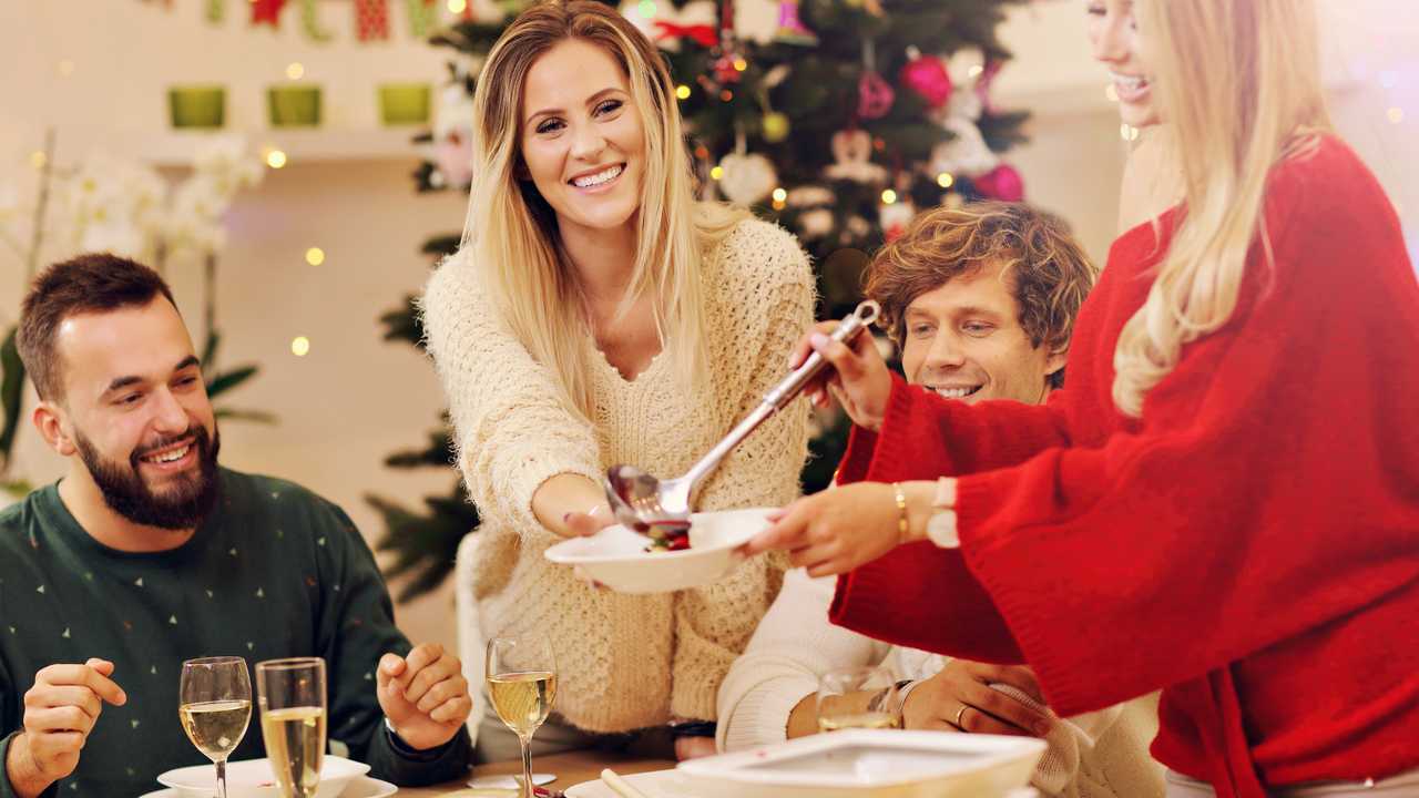 Group of family and friends celebrating Christmas dinner