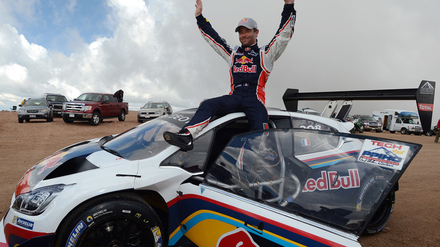 Winner Sébastien Loeb celebrates after breaking the record