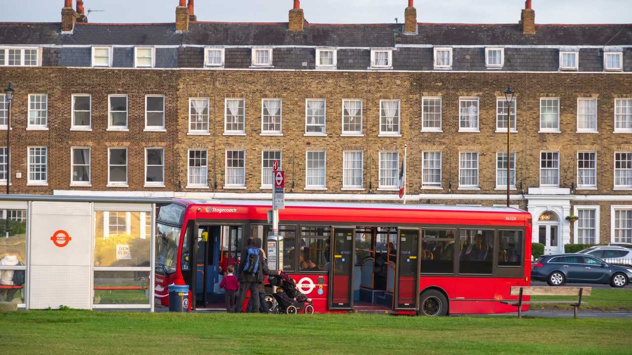 Passengers boarding bus in Blackheath London