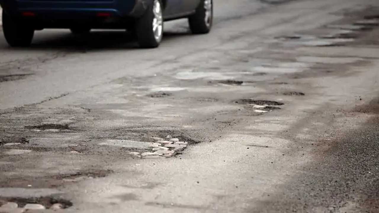 Very bad quality road with potholes