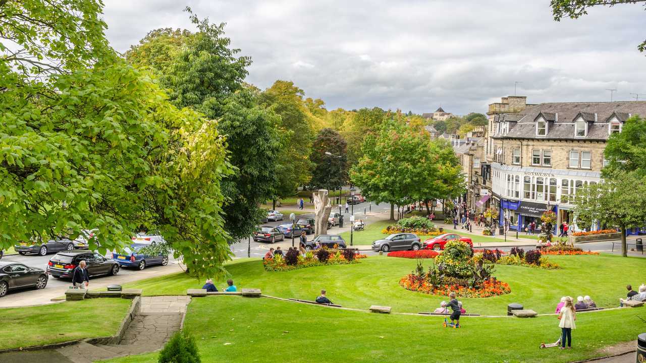 People enjoying the garden in the town centre in Harrogate UK