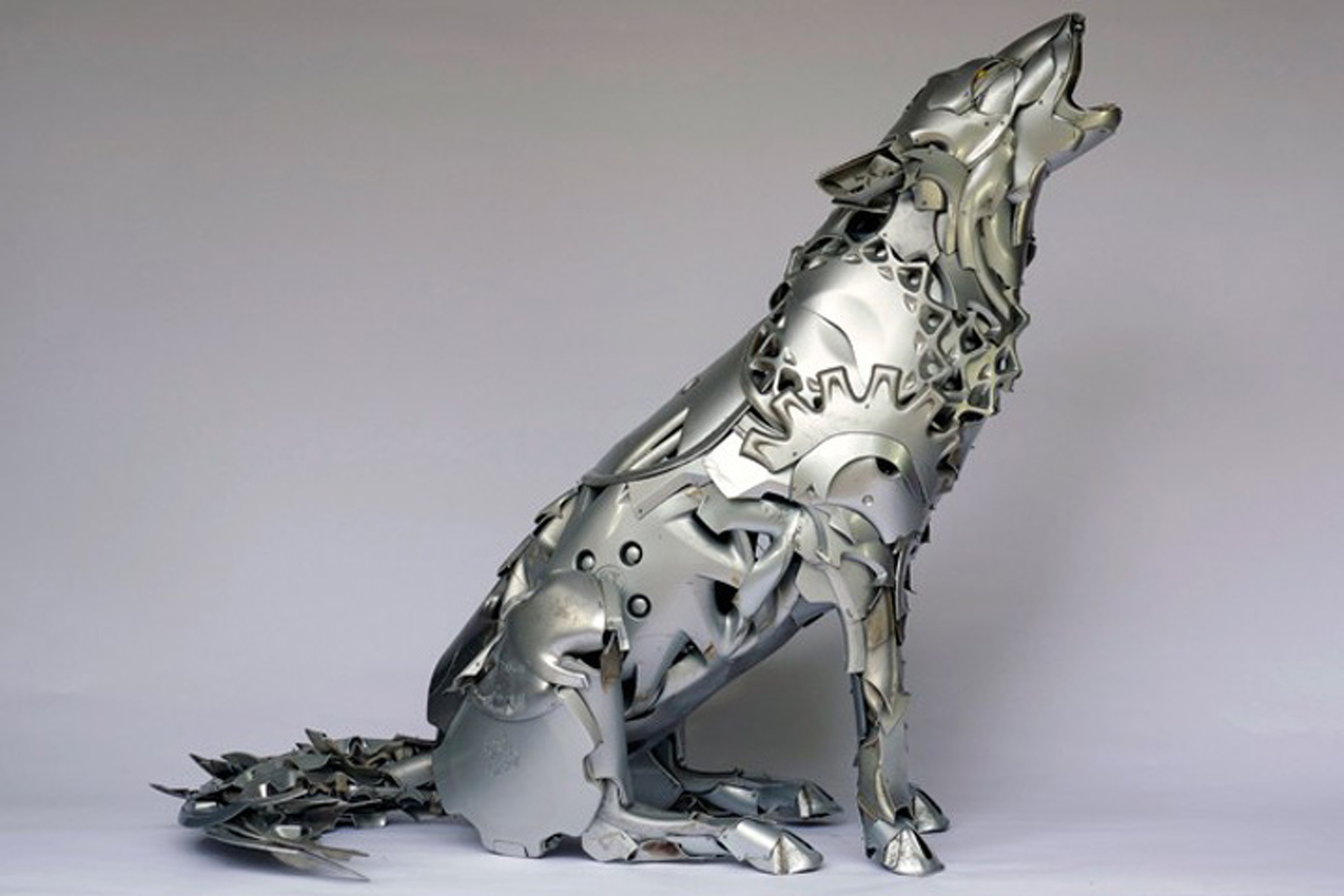Artist Turns Hubcaps into Amazing Animal Sculptures