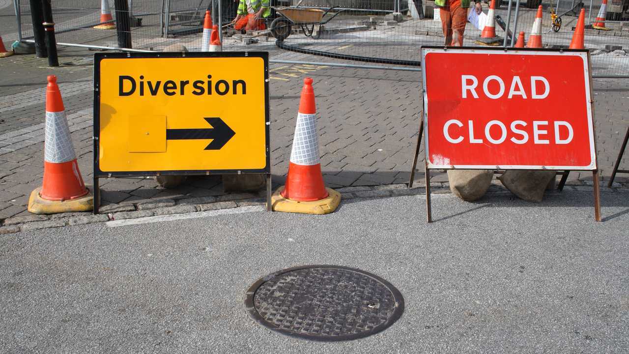 British road closed and diversion signs