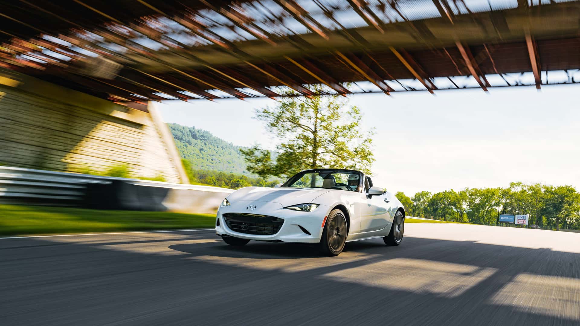 https://cdn.motor1.com/images/mgl/qk6Jov/s1/2024-mazda-mx-5-miata-grand-touring-review.jpg