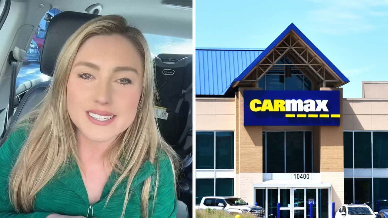 Woman finalizes purchase on CarMax