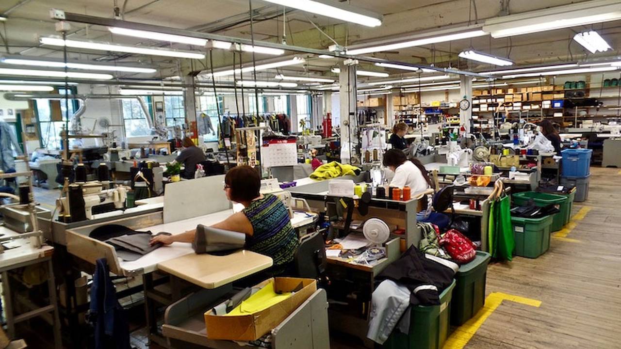 <em>Aerostich seamstresses are highly skilled, requiring extensive training before being trusted to sew the various suits.</em>