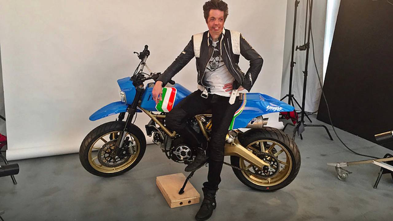 Grime posing with his custom Scrambler
