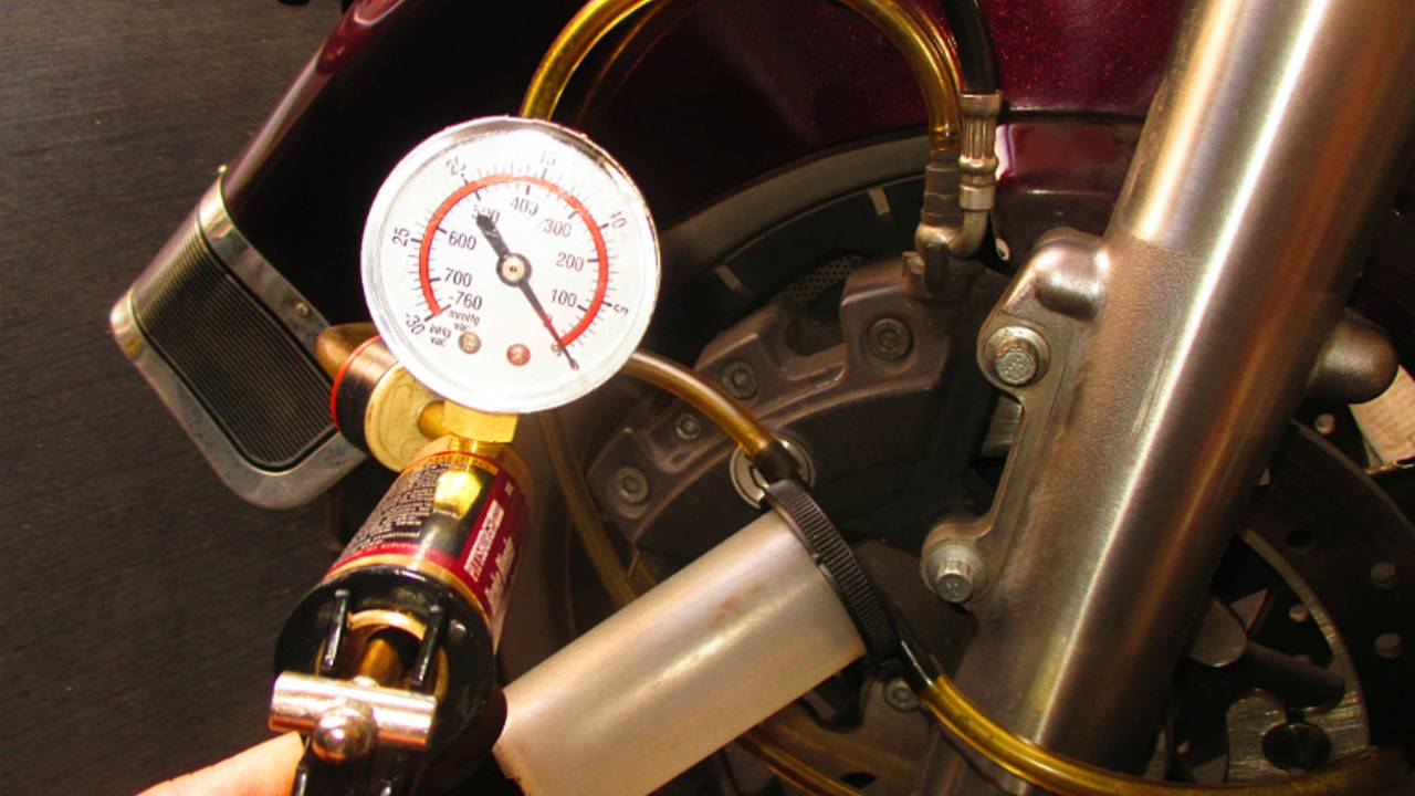 Vacuum hand pump can speed brake bleeding.