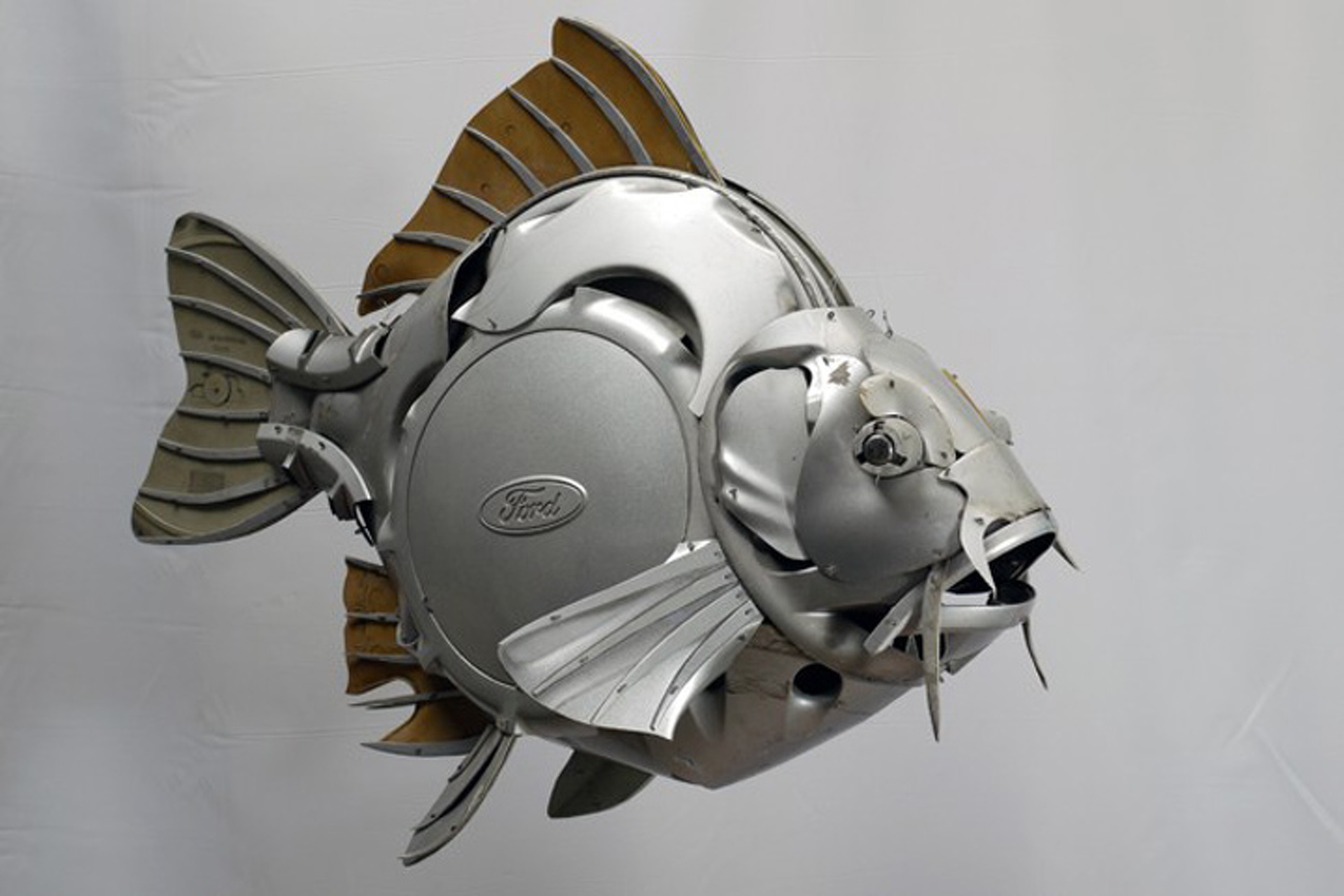 Artist Turns Hubcaps into Amazing Animal Sculptures