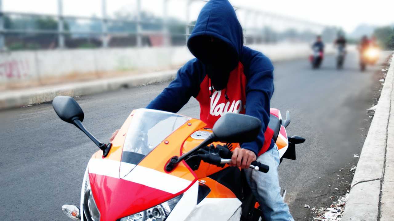 Motorcycle thief with covered face