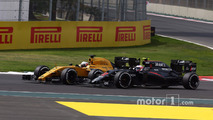 Jenson Button, McLaren Honda F1 Team MP4-31 and Jolyon Palmer, Renault Sport F1 Team RE16