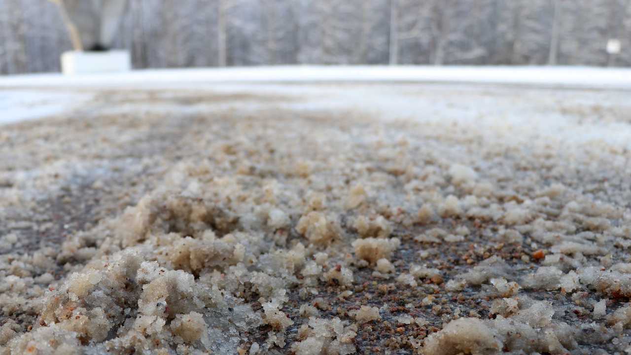 De-icing chemicals and sand on the winter road