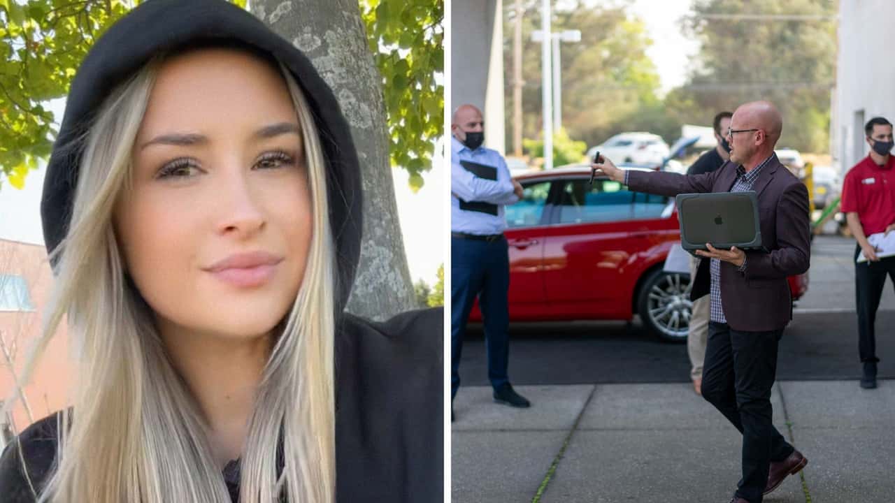 Woman closes deal on her new car.