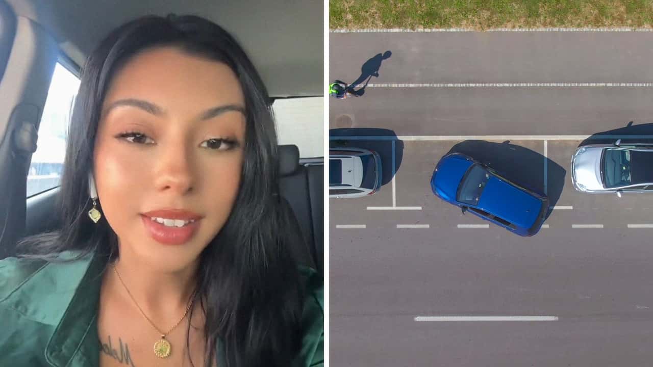 Woman tries to parallel park