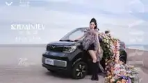 Wuling Hong Guang Mini EV Cabrio with woman posing